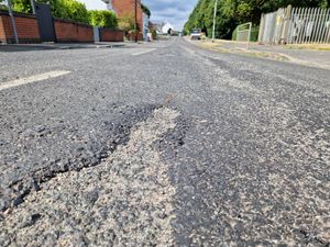 Supporting image for story: I visited 'disgraceful' melting road in Cannock and I could feel my car sticking to the floor - as residents face expensive clean up