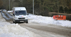 A van slides around in the snow as it makes its way along A34 Walsall Road, near Cannock