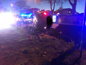 Fire crews used poles to support the overturned car. Photo: @Wton_fire