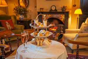 Tuck in to afternoon tea and a glass of fizz on your pet-friendly break
