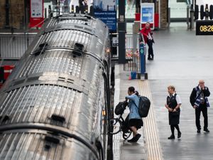 Passengers board a train