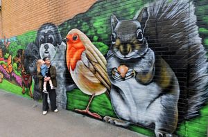 A spray paint project has been completed at Chase Leisure Centre, Cannock. The huge mural created by local children covers most of the walls of the centre. Pictured looking at the mural is local resident Geri Marron and daughter Mabel, aged 3. (Photo: Tim Thursfield/National World)