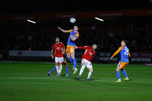 Will Boyle clears during the game between Salford City and Shrewsbury Town