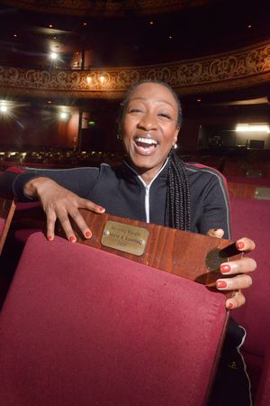 All smiles: Beverley Knight with the seat at The Grand Theatre, Wolverhampton which bears her name