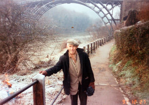 Ironbridge coracle man Eustace Rogers, with the Iron Bridge in the background. The image dates from December 27, 1993.