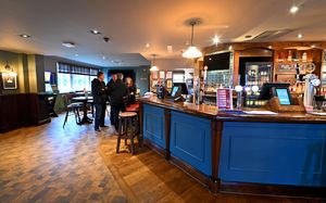 The bar area is wide, with plenty of space for customers