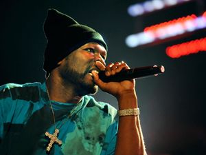 Supporting image for story: 50 Cent would never intentionally strike anyone with a microphone, says lawyer