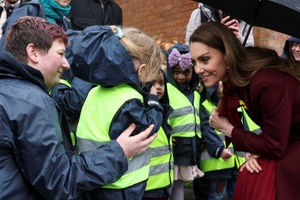 The Princess of Wales greets children as she arrives to visit the Oriel Davies art gallery