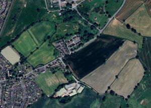 The new development would be built on a plot of land on the outskirts of Wem (the darker green field pictured here). Photo: Google