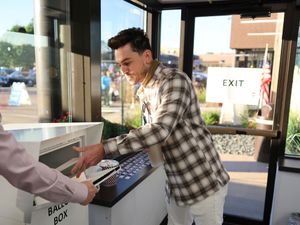 Supporting image for story: First in-person votes cast in US presidential election