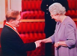 Sir Kevin is knighted by the Queen