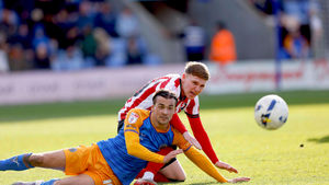 Tom Sang slides in for Shrewsbury Town 