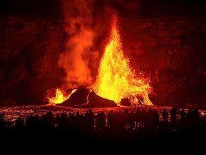 A fountain of lava spews from a volcano