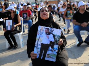 Supporting image for story: Grieving and angry Lebanese mark year since horrific blast