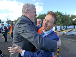 Supporting image for story: Political rivals embrace as city's rail training centre opens