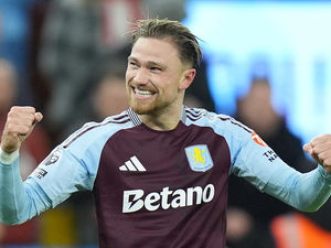 Aston Villa's Matty Cash celebrates scoring their side's third goal against Brentford.