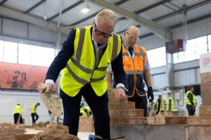 Mayor Richard Parker learns the art of brick laying with by Rob Smith, curriculum manager at Dudley College’s Technical Hub, at the launch of the £75m construction skills package in October 2025 