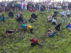Supporting image for story: Daredevils defy weather for annual cheese rolling races