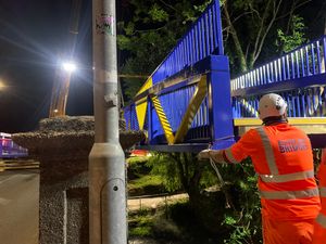 The Meole footbridge - and its blue and amber paint job - was lifted into place over the weekend.