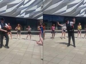 Supporting image for story: This policeman laying down some moves with a dance troupe is the video we all need right now