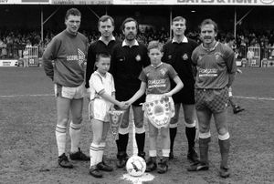 David Moyes, as the Shrewsbury Town captain, with the mascots before the Rotherham match in Division Three in February 1990. (Picture: © AMA/Matthew Ashton)