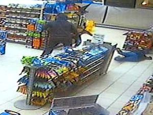 Supporting image for story: Caught on camera: Woman pushed to floor in armed robbery drama