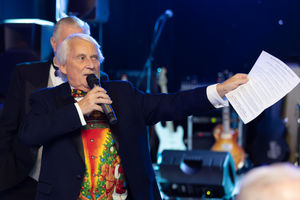 Rick Cressman runs the charity auction. Photo by Visually Virtual Photography.