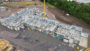 Pre-manufactured frames and panels have started to be lifted into place. Photo: McPhillips