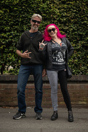 Music fans Craig Marker (L) and Camilla Sharp (R) arrive to attend British rock band Black Sabbath's "Back to The Beginning" concert, Ozzy Osbourne's final ever gig as Black Sabbath's frontman at Villa Park in Birmingham, central England on July 5, 2025. Osbourne, who revealed in 2020 that he has Parkinson's disease, will join Tony Iommi, Geezer Butler and Bill Ward for the all-day "Back To The Beginning" show in Birmingham, central England, where the heavy metal giants formed in 1968. (Photo by Oli SCARFF / AFP) (Photo by OLI SCARFF/AFP via Getty Images)          