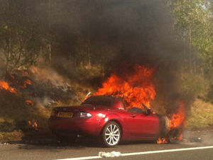 Supporting image for story: Pictured: Sports car bursts into flames on M6 Toll