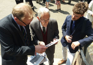 Mark Adams, whose grandfather Lieutenant Geoff Bright led the attack at Bligny, looks at photographs brought along by 86-year-old Brian Peace, whose father 2nd Lieutenant Geoffrey Peace of Wellington fought under Lieutenant Bright at Bligny.