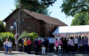Many mourners gathered outside the church as the service was held 