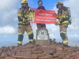Supporting image for story: 'He was like the dad of the group': Firefighters who climbed 'Welsh Three Peaks' in full kit made mountain-top tribute to late colleague