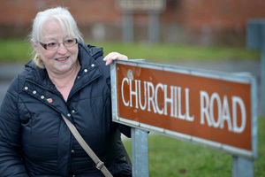 Chris Framingheddu with the Churchill Road sign she says makes the street well known