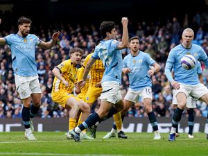 Abdukodir Khusanov, centre, scores an own goal for Brighton’s second