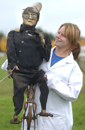One of the more unusual lots was this dummy unicyclist, who was rigged up to perform a "high wire act" over the River Severn. It is seen here with Gemma Noble from Job Dunn who cleared Eustace Rogers' house.