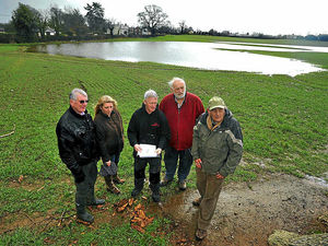 Supporting image for story: Protesters point to lake on Shropshire homes plan site