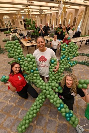 Moor Hall Hotel & Spa, Sutton Coldfield, and Britains first Christmas Tree balloon is under way at being built. Its helping to raise money for charity. In the white T is organiser: Naomi Spencer, With her is: Lisa Corne and Anastasia Powell. At the back, no particular order is: Dr Bob Armstrong, Matt Lewis, Greta Ruseckiene, Chantal Lord Dominic Cassidy, Keith Sturman, Sue Bowler, Danielle Powell, Anastasia Powell and Lisa Corne.