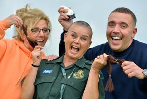 Carol, Donna and Ryan celebrate the end of the shave, which has raised £3,000 and will see Donna's hair also go to charity to create wigs