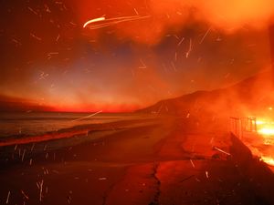 Supporting image for story: Firefighters battle devastating Los Angeles wildfires as winds ease a little