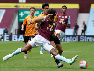 Aston Villa's Tyrone Mings (front)
