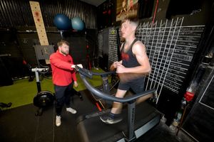 Josh Greer, 20, at Rigorous Gym in Welshpool with his trainer Warren Sinden.
