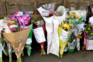 Floral tributes left outside the home after the fatal stabbing