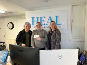 Supporting image for story: Community centre accepts donation from Shrewsbury firm