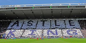 West Brom fans seated in the Birmingham Road End lift up coloured cards to pay tribute to The King on Astle Day