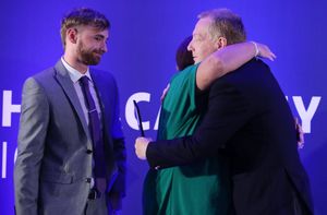  Joel Richard's mum, Suzy, hugs Wing Commander Neil Hope after presenting the award that bears her son's name.