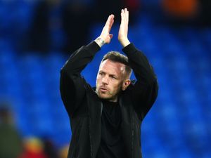 Wales manager Craig Bellamy raises his arms