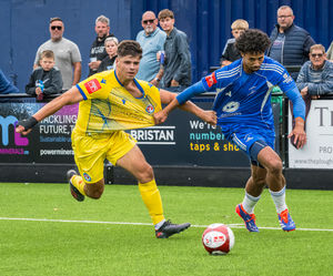 Joe Thompson (R) and Dom Hoppe (L) try to swap shirts early. (Image by Jim Wall)