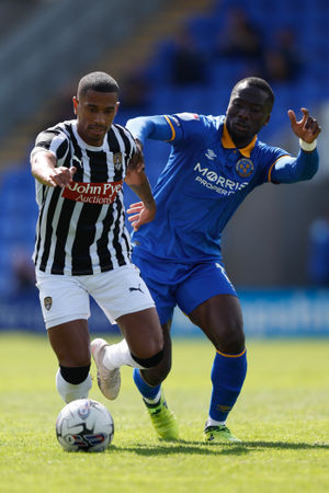 Richard Brindley of Notts County and Dan Udoh of Shrewsbury Town (AMA)