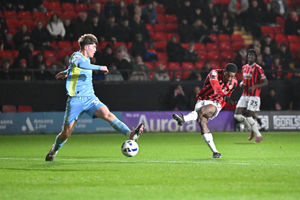 Walsall striker Daniel Kanu sees an early drive saved by Fleetwood goalkeeper Jay Lynch.